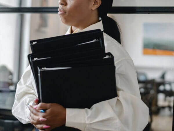 Woman Holding Binders